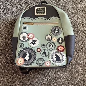 Loungefly Mint and Black Backpack with Alice Silhouettes